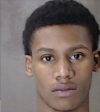 a mug shot of a young man